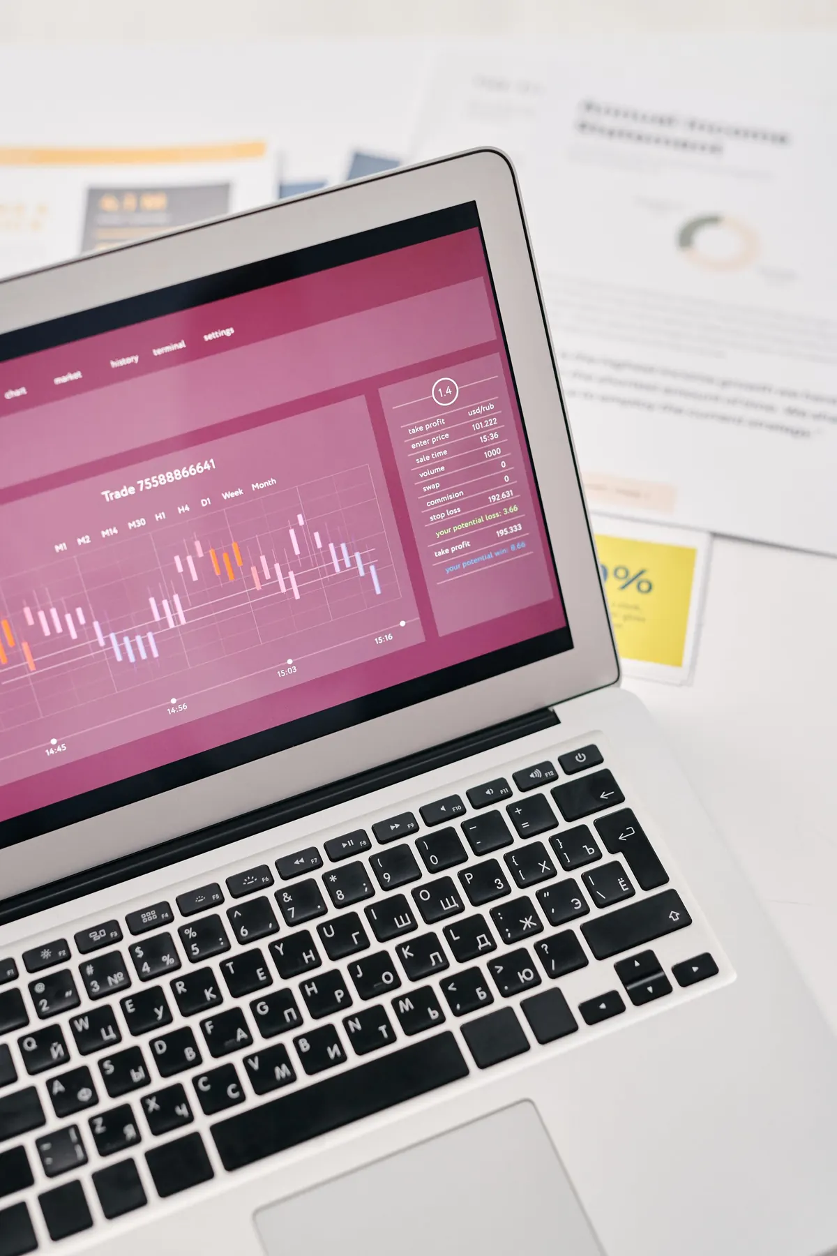 Analytics laptop and printed reports for PPC review