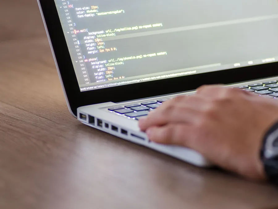 Website development code on a laptop during a build review